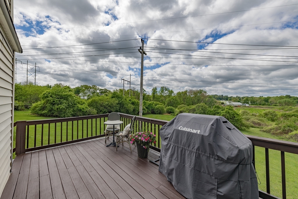 7 Adirondack Road Chelmsford, MA 01824 - Photo 23 of 31 a view of a wooden deck with a yard