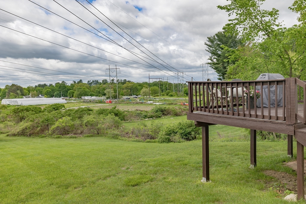 7 Adirondack Road Chelmsford, MA 01824 - Photo 27 of 31 a view of a bench in the garden near a lake