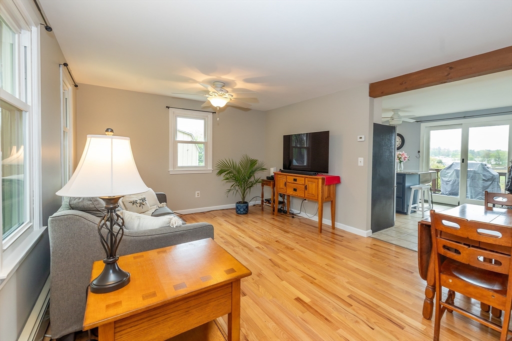 7 Adirondack Road Chelmsford, MA 01824 - Photo 8 of 31 a living room with furniture and a flat screen tv