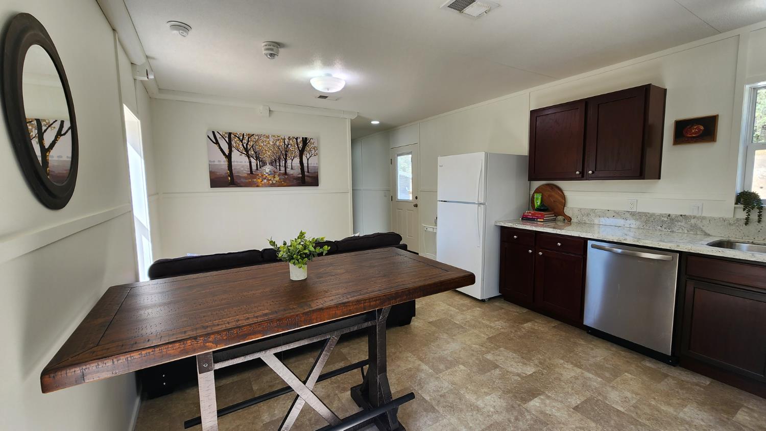 55062 Oak Crest Court Wishon, CA 93669 - Photo 14 of 57 a living room with stainless steel appliances kitchen island a stove a refrigerator a sink and a stove with wooden floor