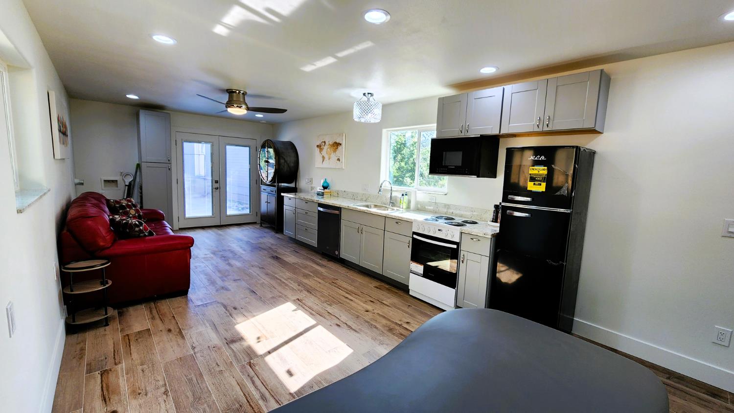 55062 Oak Crest Court Wishon, CA 93669 - Photo 30 of 57 a living room with stainless steel appliances furniture a fireplace and a open kitchen view