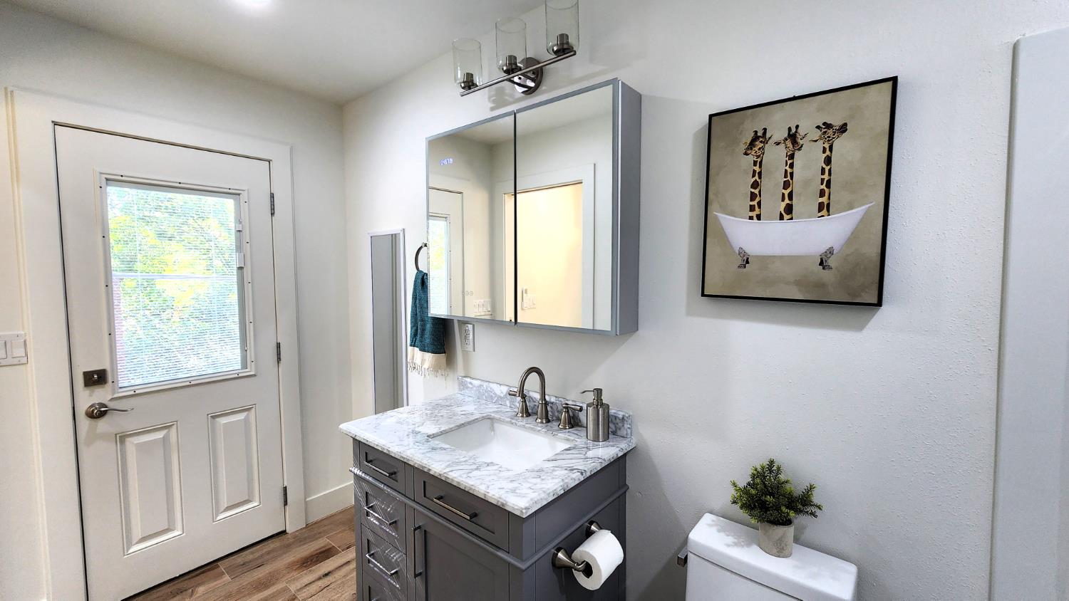 55062 Oak Crest Court Wishon, CA 93669 - Photo 32 of 57 a bathroom with a granite countertop sink mirror and vanity