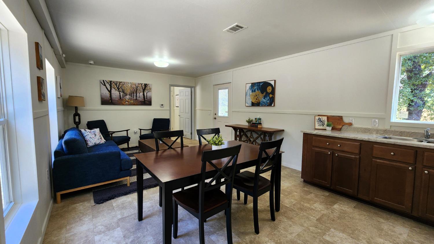 55062 Oak Crest Court Wishon, CA 93669 - Photo 43 of 57 a living room with furniture and a dining table with window