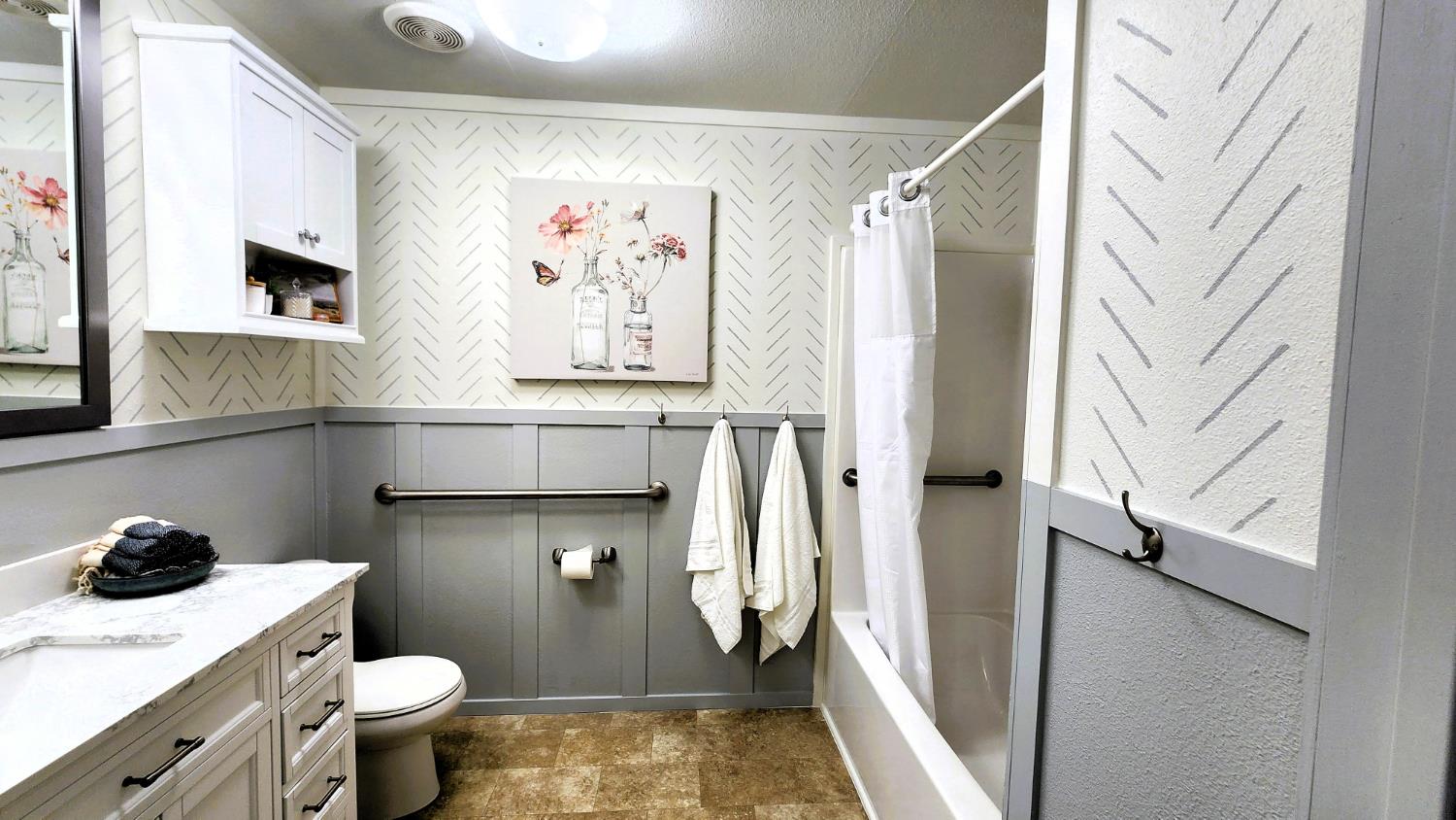 55062 Oak Crest Court Wishon, CA 93669 - Photo 46 of 57 a bathroom with a toilet sink and shower curtain