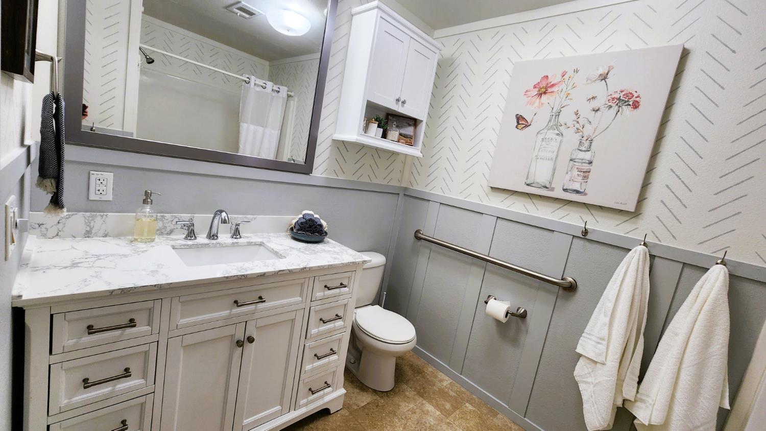 55062 Oak Crest Court Wishon, CA 93669 - Photo 47 of 57 a bathroom with a granite countertop sink toilet and a mirror