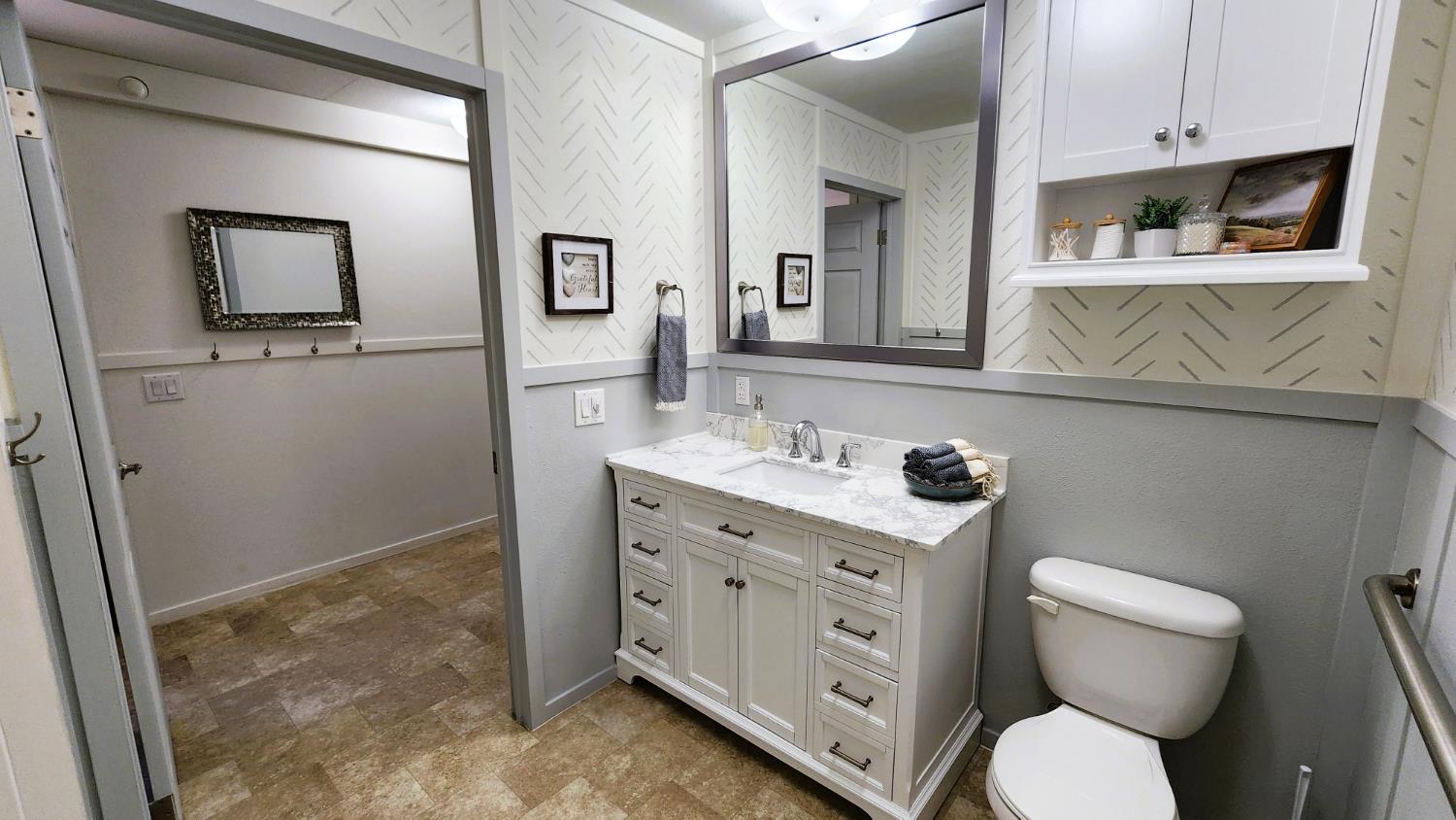 55062 Oak Crest Court Wishon, CA 93669 - Photo 49 of 57 a bathroom with a toilet sink and mirror