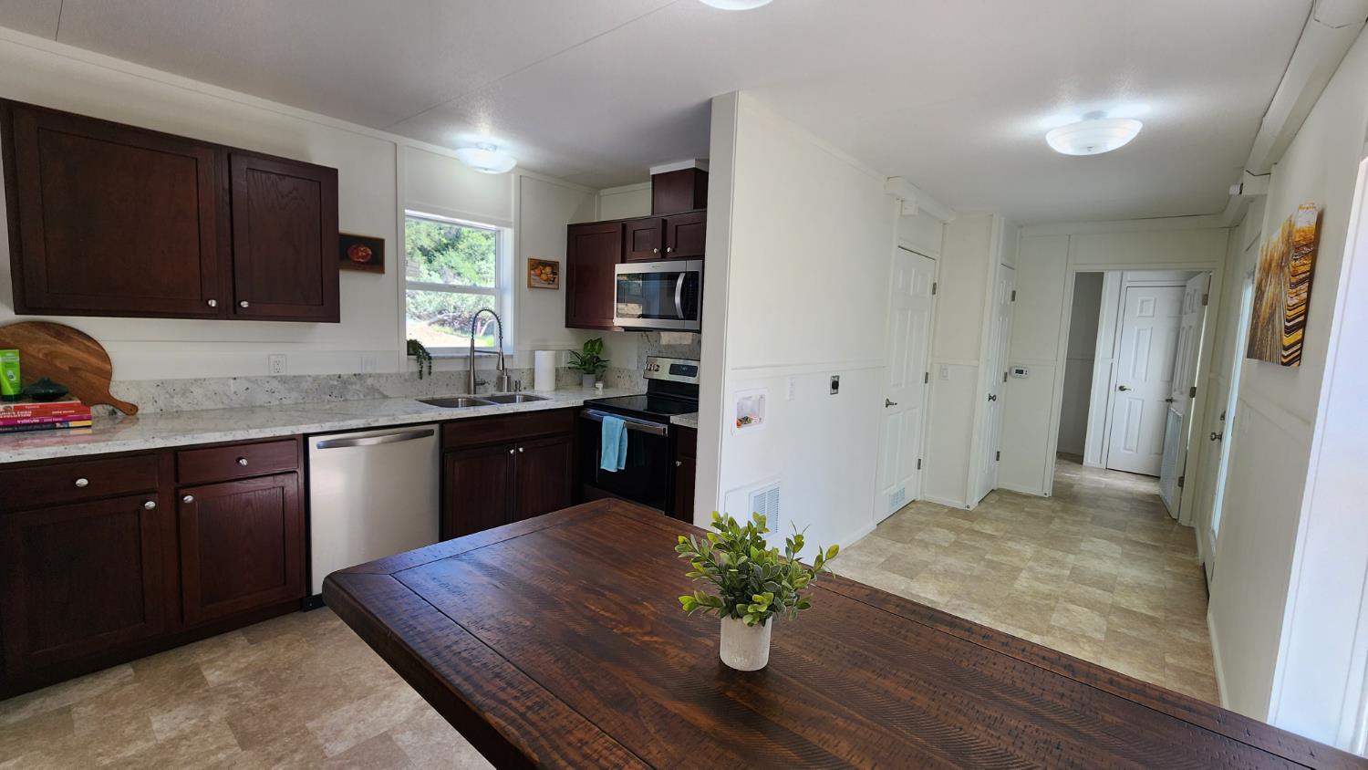 55062 Oak Crest Court Wishon, CA 93669 - Photo 7 of 57 a kitchen with stainless steel appliances granite countertop a sink dishwasher stove and refrigerator