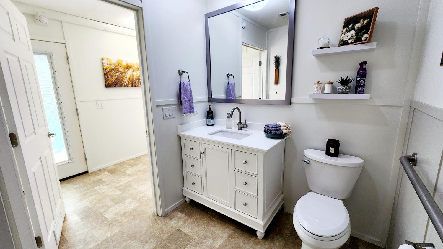 55062 Oak Crest Court Wishon, CA 93669 - Photo 9 of 57 a bathroom with a toilet sink and mirror