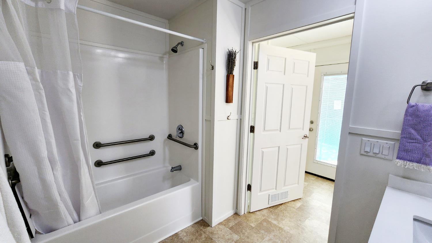 55062 Oak Crest Court Wishon, CA 93669 - Photo 10 of 57 a bathroom with a bathtub and a shower