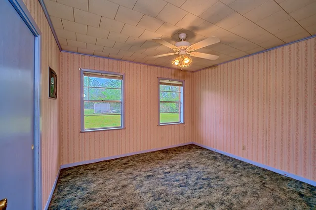 an empty room with windows