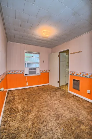 a view of a kitchen with a sink and a fireplace