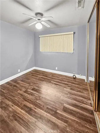 a view of a room with a ceiling fan