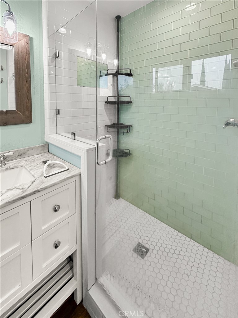 15 Regent Loop Oroville, CA 95966 - Photo 10 of 22 a bathroom with a granite countertop sink a toilet a mirror and shower