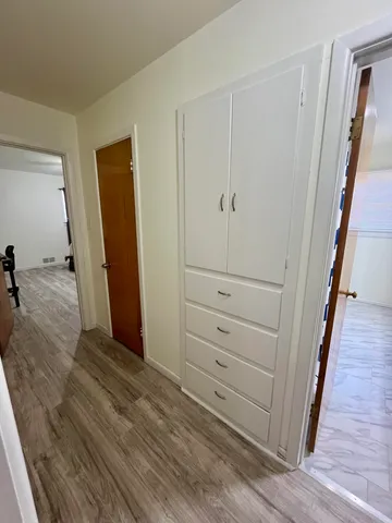 a view of a hallway with closet