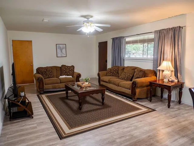 a living room with furniture and a window