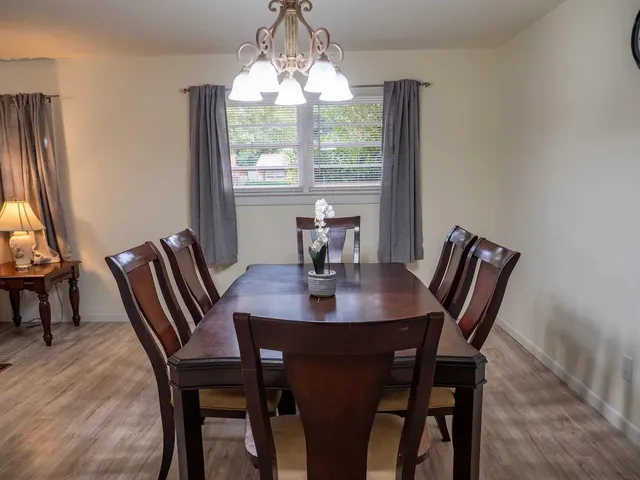 a view of a dining room with furniture window and outside view