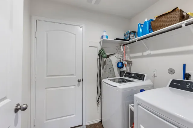 a view of a house with backyard and a garden