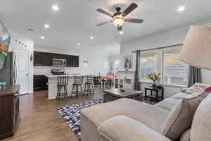 a living room with furniture and a large window