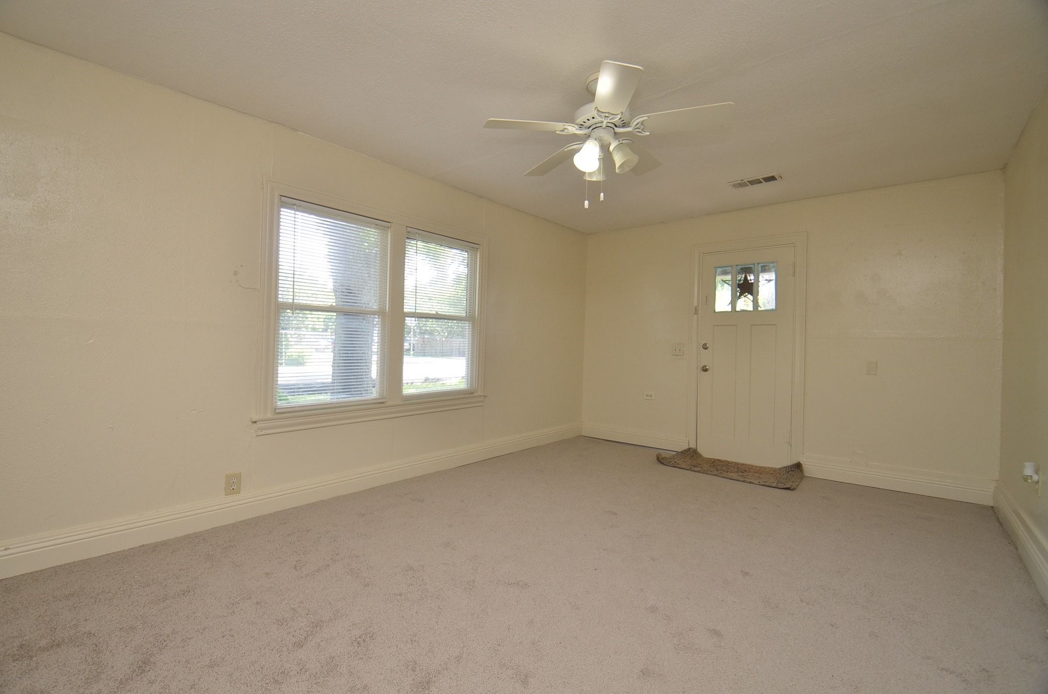 1600 5th Street Rosenberg, TX 77471 - Photo 5 of 24 Bright living room with neutral paint and abundant natural light.