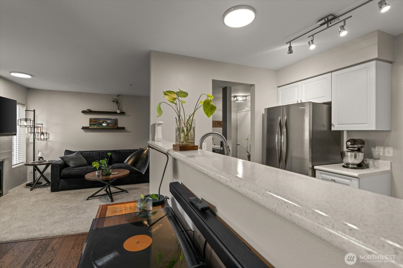 15150 140th Way Southeast, Unit T104 Renton, WA 98058 - Photo 15 of 40 a large kitchen with a sink stainless steel appliances and cabinets