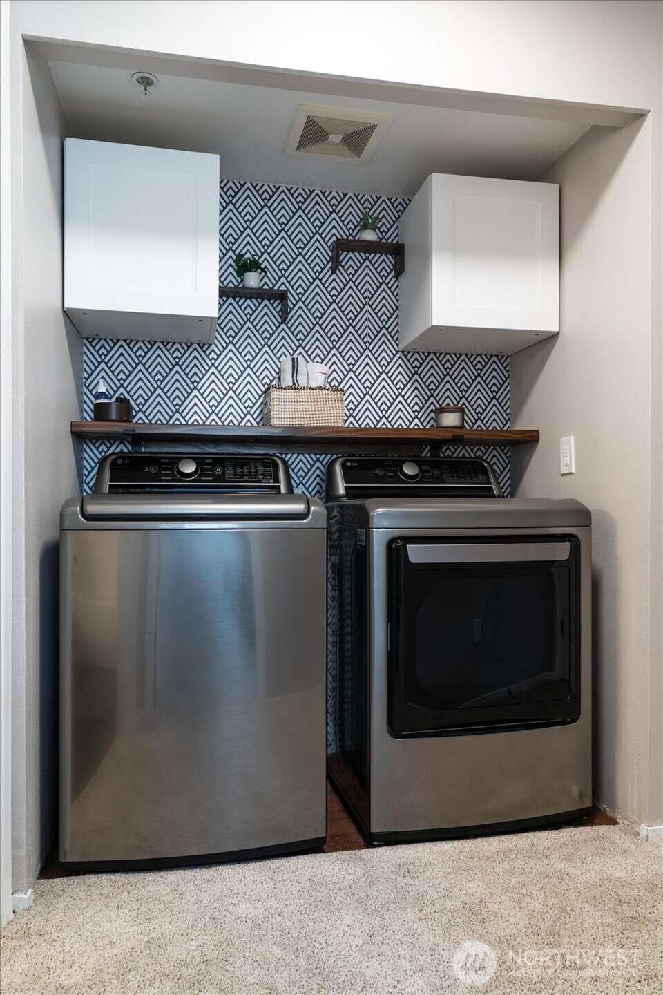 15150 140th Way Southeast, Unit T104 Renton, WA 98058 - Photo 28 of 40 a stove top oven sitting inside of a kitchen