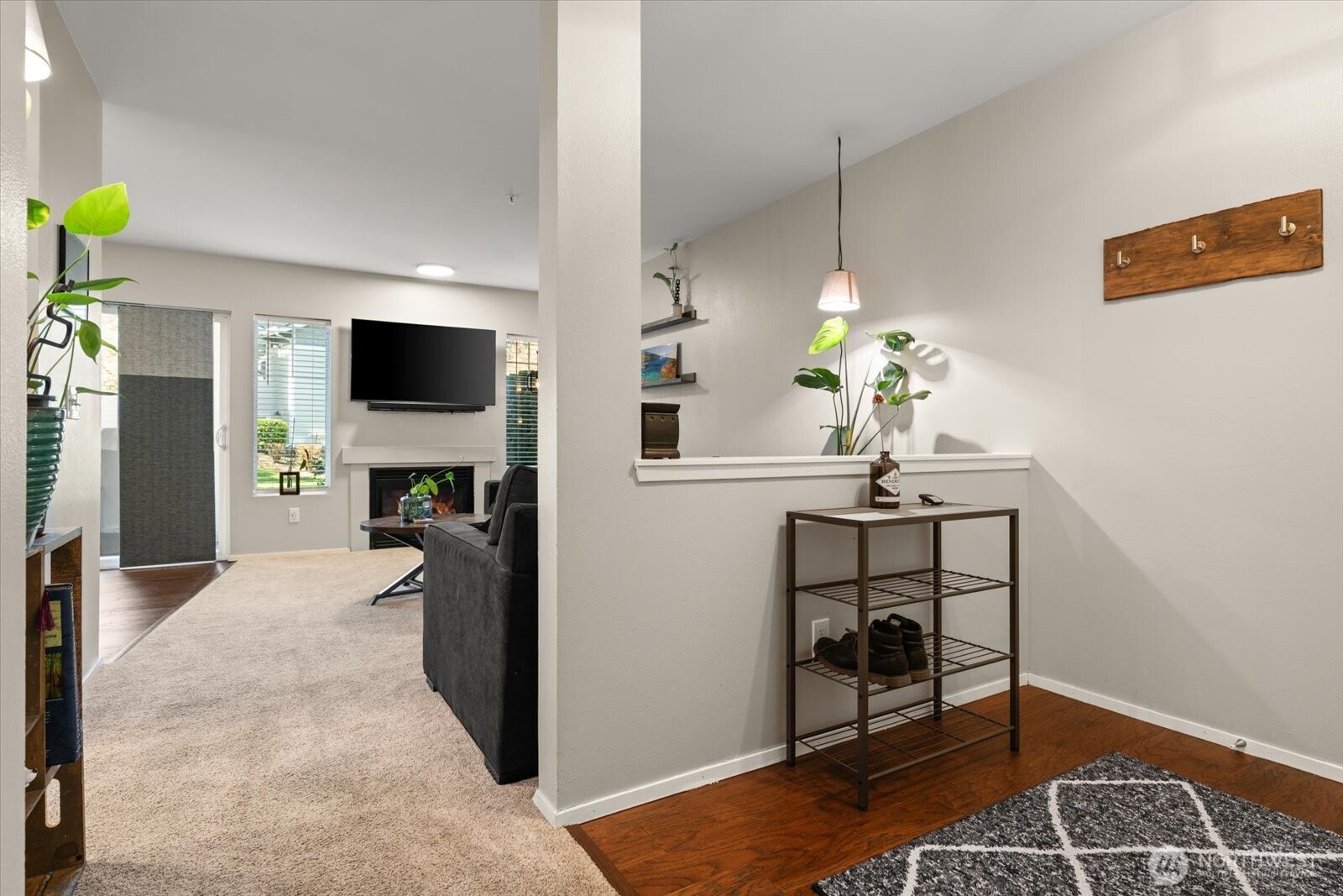 15150 140th Way Southeast, Unit T104 Renton, WA 98058 - Photo 5 of 40 a living room with furniture and a flat screen tv