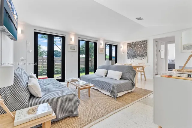 a view of a dining room with furniture and window