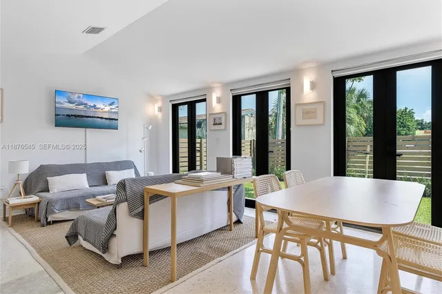a kitchen with stainless steel appliances granite countertop a sink and a refrigerator