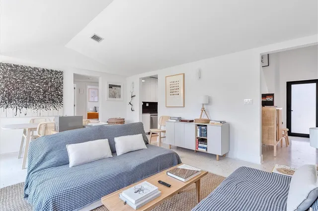 a spacious bathroom with a granite countertop sink a toilet and shower