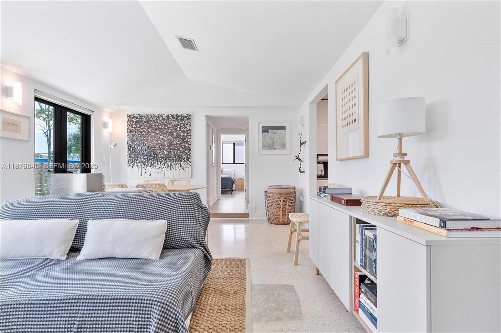 1076 Northwest 55th Street Miami, FL 33127 - Photo 19 of 96 a living room with furniture and a table