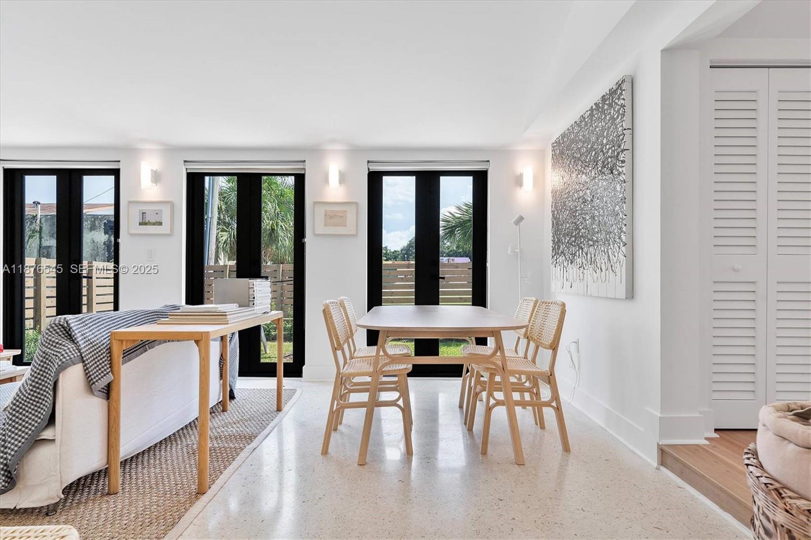 1076 Northwest 55th Street Miami, FL 33127 - Photo 20 of 96 a view of a dining room with furniture and window