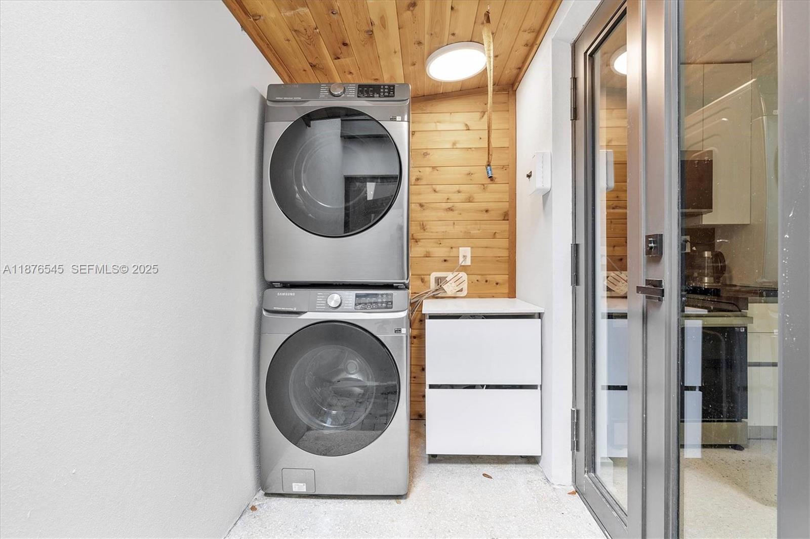 1076 Northwest 55th Street Miami, FL 33127 - Photo 28 of 96 a close view of a utility room with dryer and washer