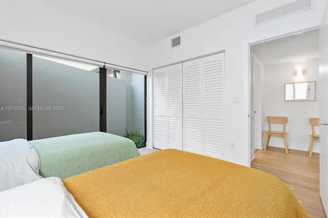 an aerial view of residential houses with outdoor space and swimming pool