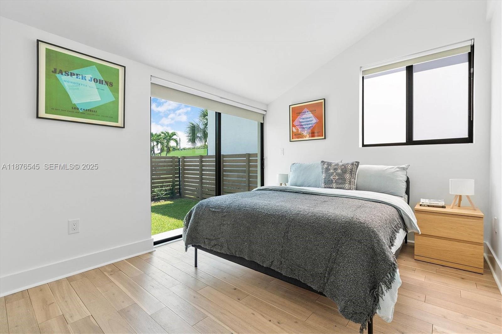 1076 Northwest 55th Street Miami, FL 33127 - Photo 39 of 96 a bedroom with a bed and a window