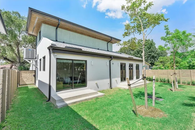 front view of a house with a wooden fence