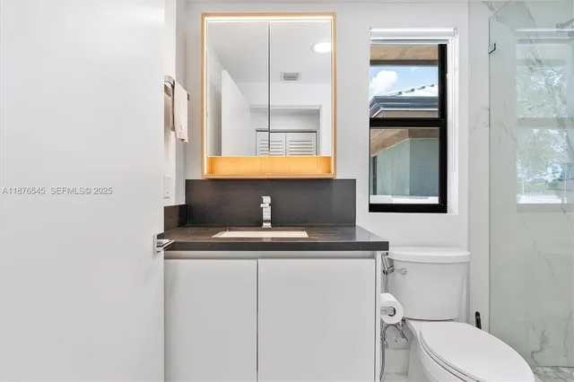 a kitchen with a stove and a microwave