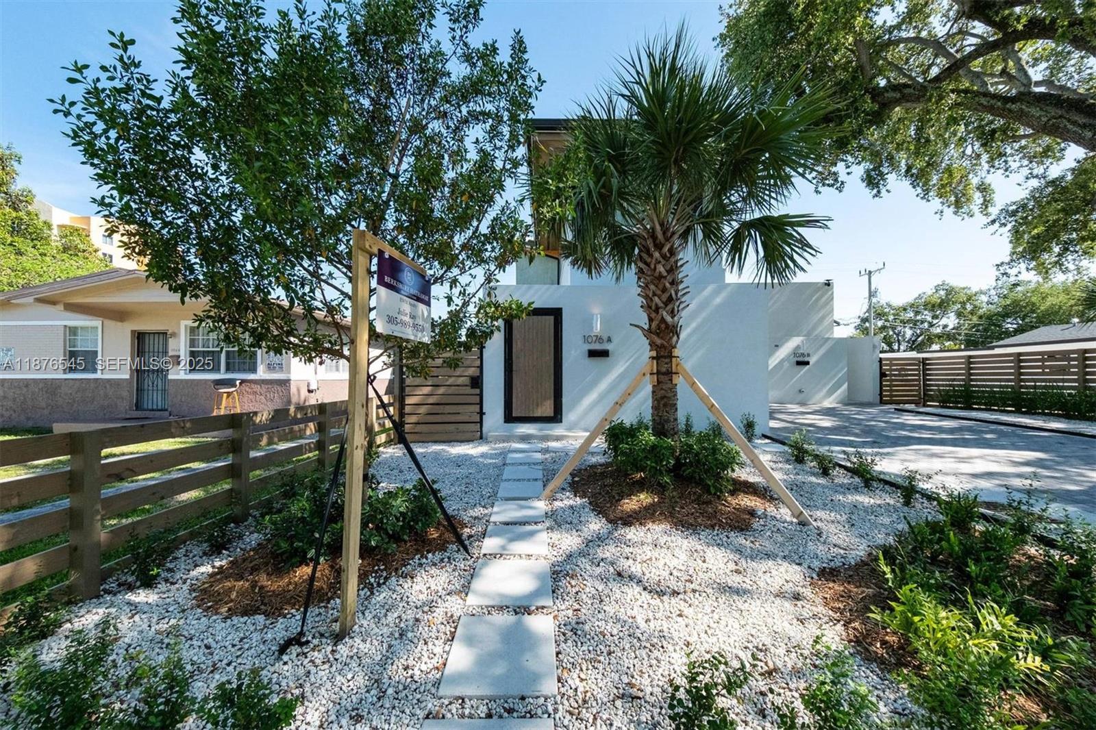 1076 Northwest 55th Street Miami, FL 33127 - Photo 60 of 96 a front view of a house with garden