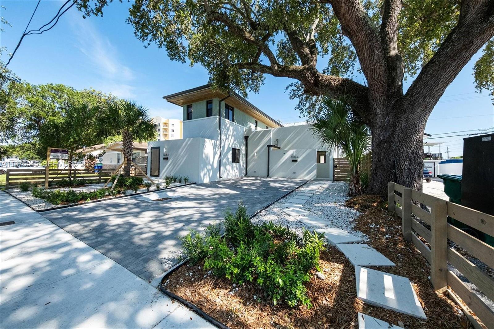 1076 Northwest 55th Street Miami, FL 33127 - Photo 63 of 96 a view of a house with a yard