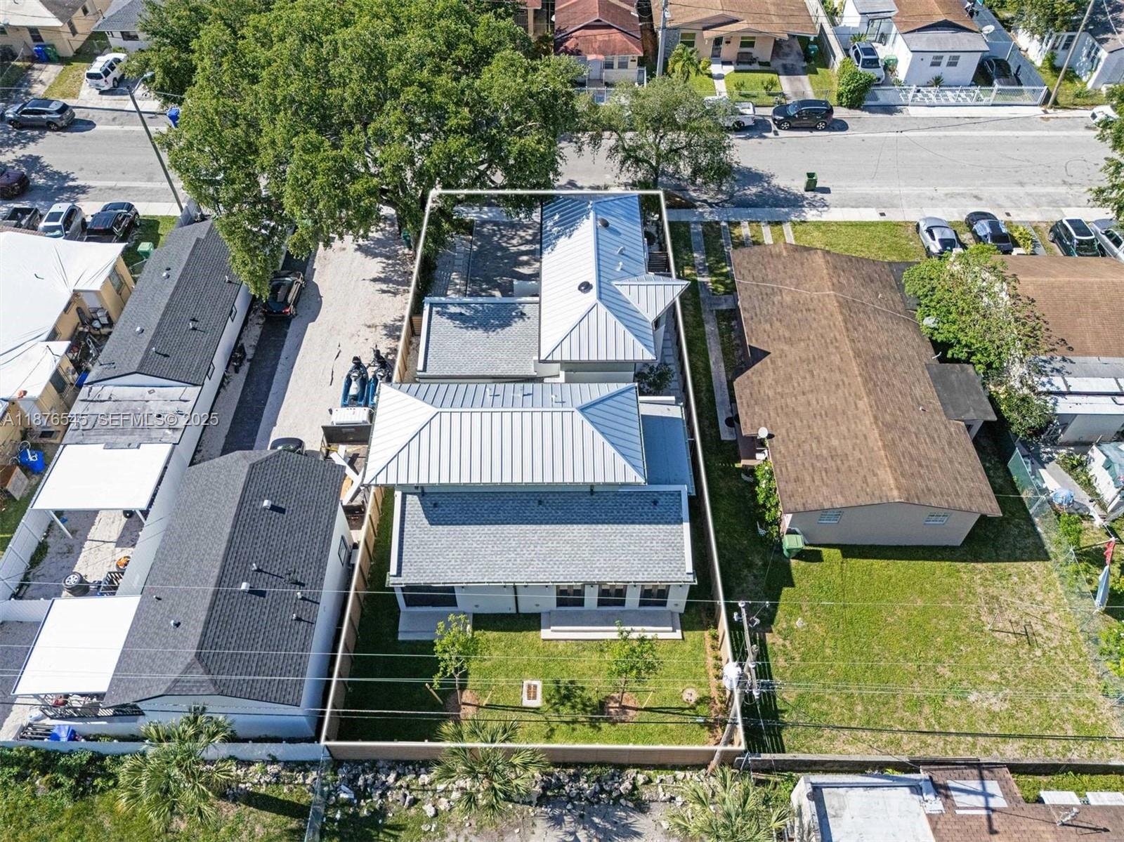 1076 Northwest 55th Street Miami, FL 33127 - Photo 71 of 96 an aerial view of a house with swimming pool