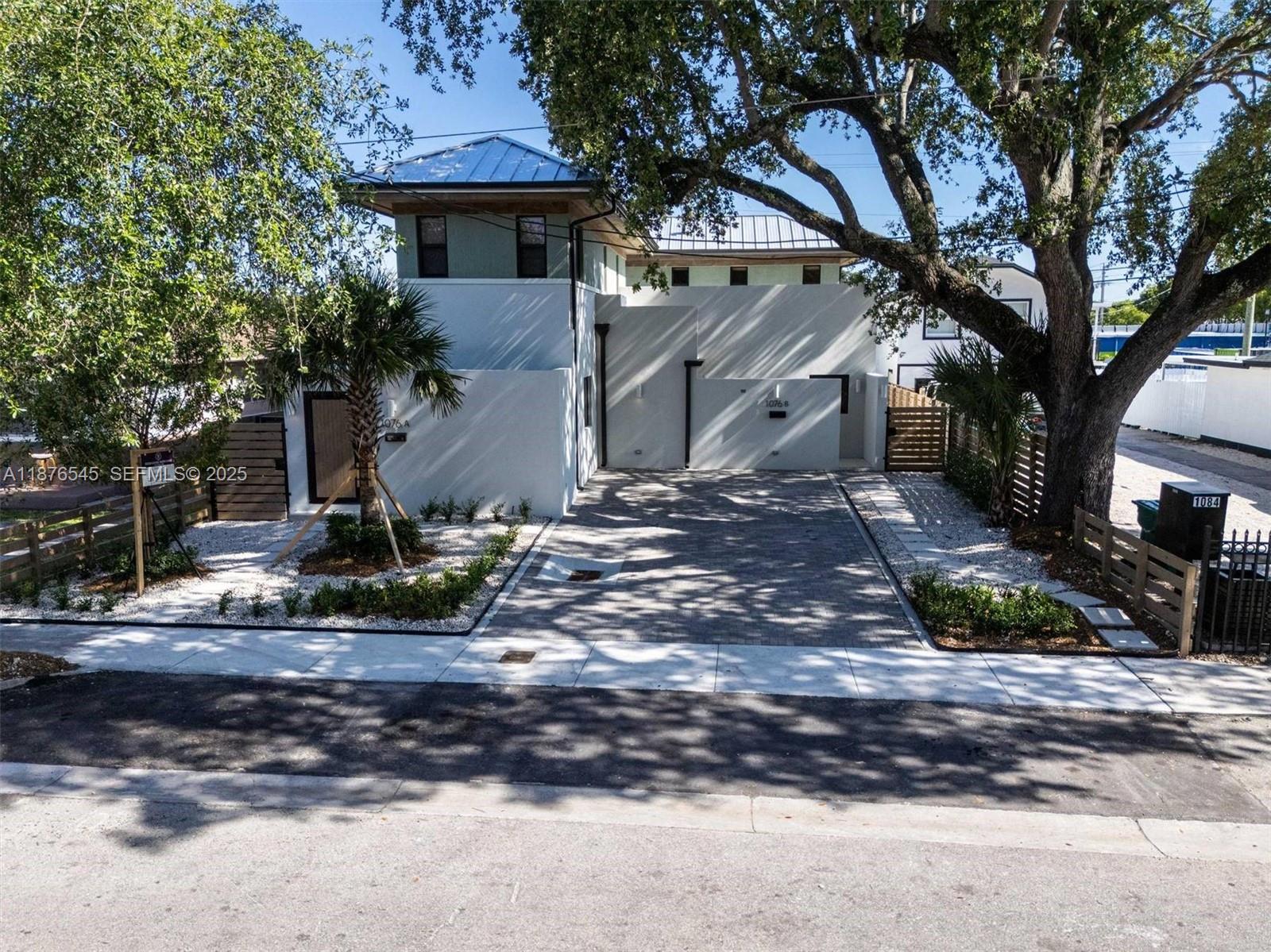 1076 Northwest 55th Street Miami, FL 33127 - Photo 75 of 96 a view of a house with a yard