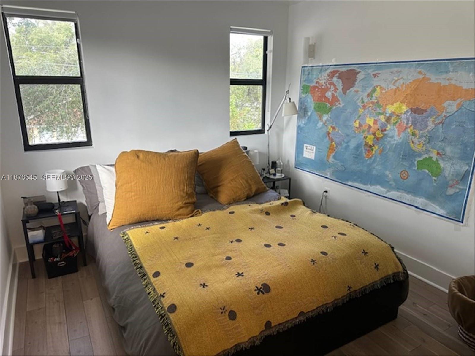 1076 Northwest 55th Street Miami, FL 33127 - Photo 76 of 96 a bedroom with a bed and wooden floor