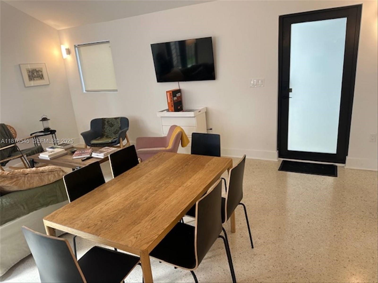 1076 Northwest 55th Street Miami, FL 33127 - Photo 79 of 96 a view of a dining room with furniture