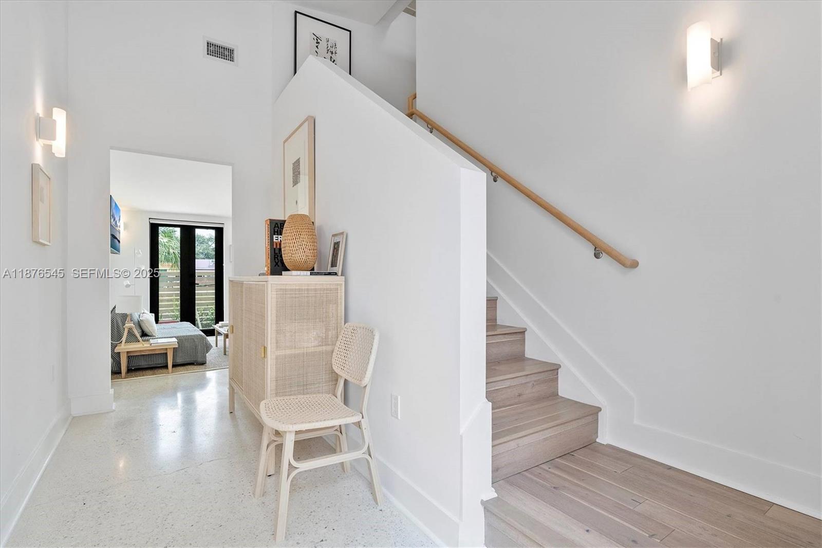 1076 Northwest 55th Street Miami, FL 33127 - Photo 9 of 96 a living room with furniture and a wooden floor