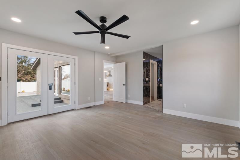 995 Skyline Boulevard Reno, NV 89509 - Photo 19 of 34 a view of a livingroom with a ceiling fan window and wooden floor