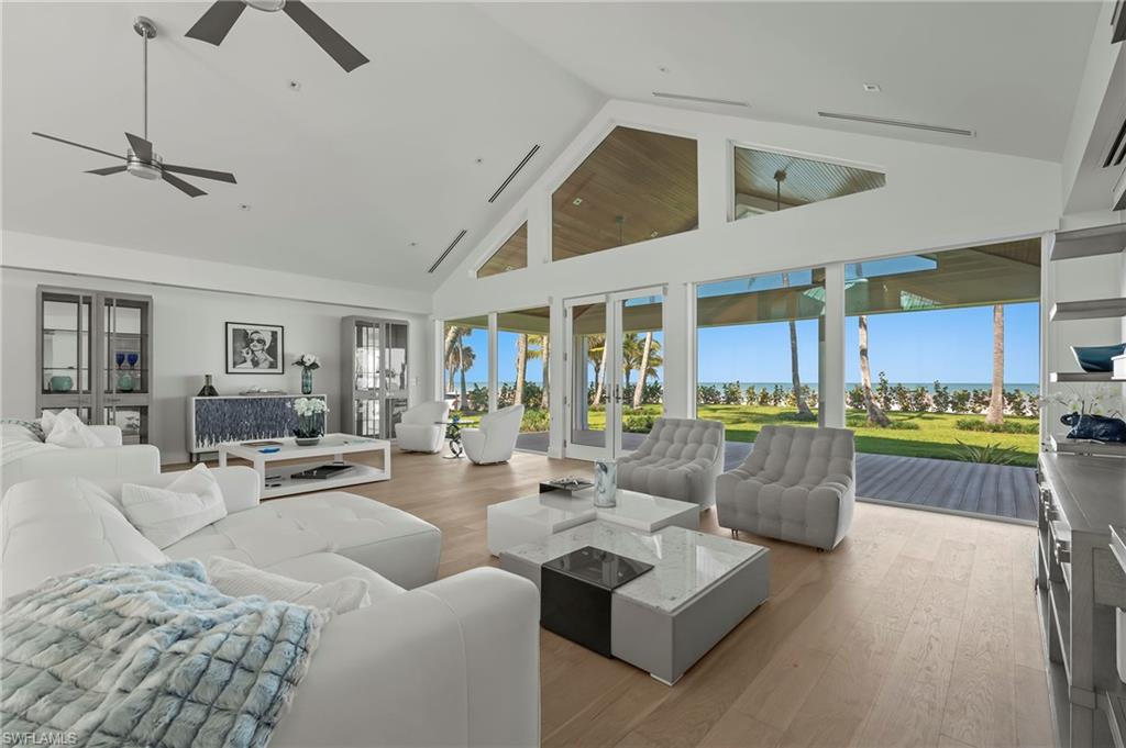 71 18th Avenue South Naples, FL 34102 - Photo 11 of 50 a living room with furniture and a large window
