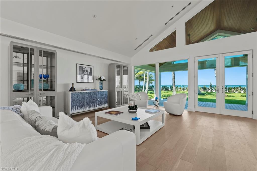 71 18th Avenue South Naples, FL 34102 - Photo 12 of 50 a living room with furniture and a large window