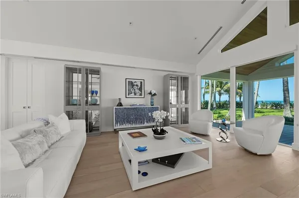 a living room with furniture and a table