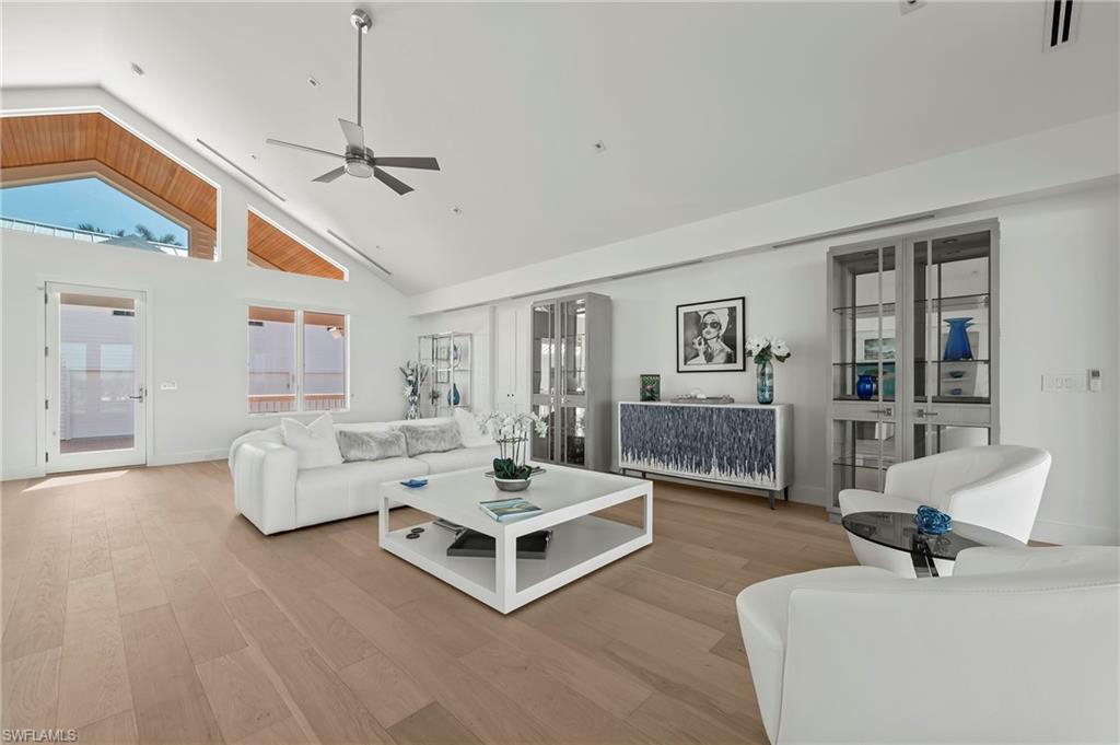 71 18th Avenue South Naples, FL 34102 - Photo 14 of 50 a living room with furniture and wooden floor