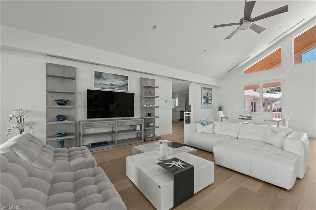 71 18th Avenue South Naples, FL 34102 - Photo 16 of 50 a living room with furniture and a flat screen tv