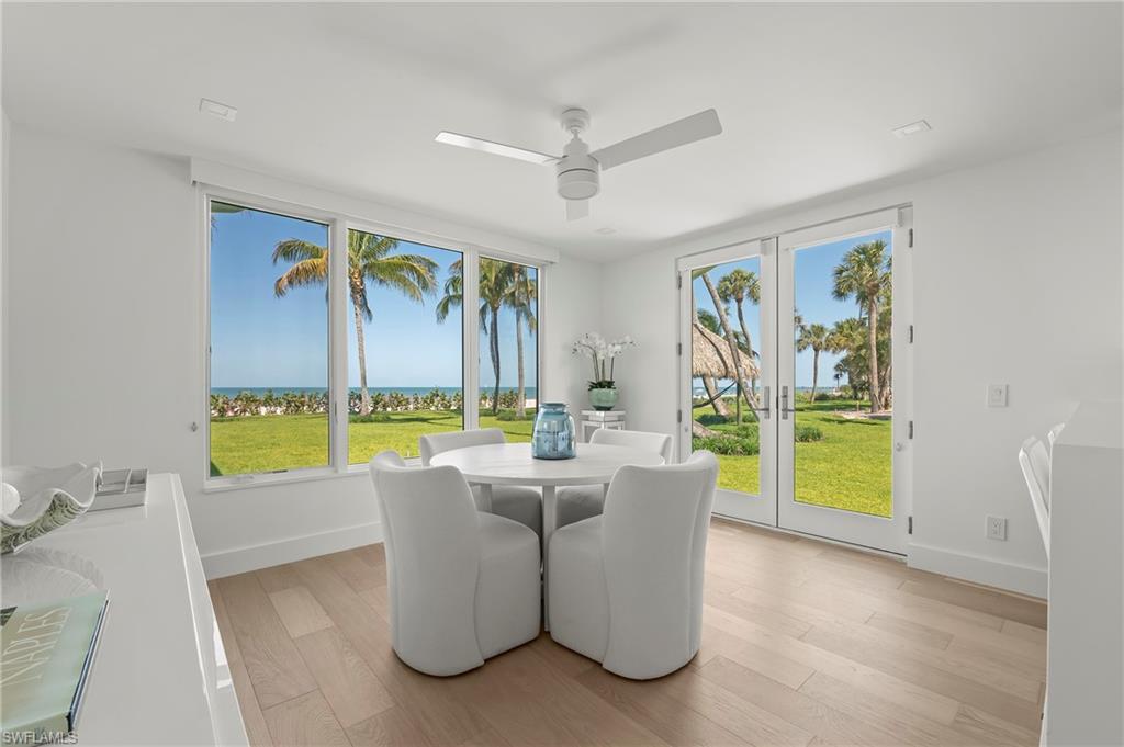 71 18th Avenue South Naples, FL 34102 - Photo 19 of 50 a living room with furniture and a large window